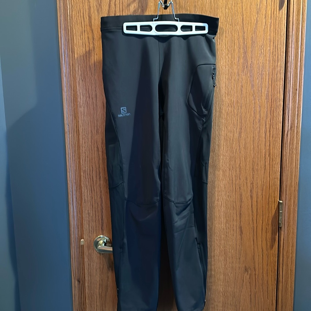 Men’s Salomon Wind Shield pants, size medium, zippered bottom cuffs.